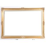 A modern gilt frame wall mirror The rectangular bevelled plate within an ornate gilt frame,