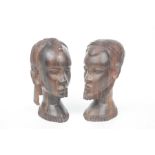 A pair of carved African Zebrawood busts Modelled as a male and female tribes person,