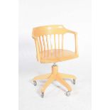 A contemporary revolving office chair by Calligaris The concave back above a revolving and
