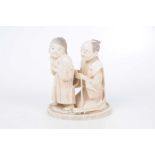 A Japanese carved ivory Okimono depicting a father and child,