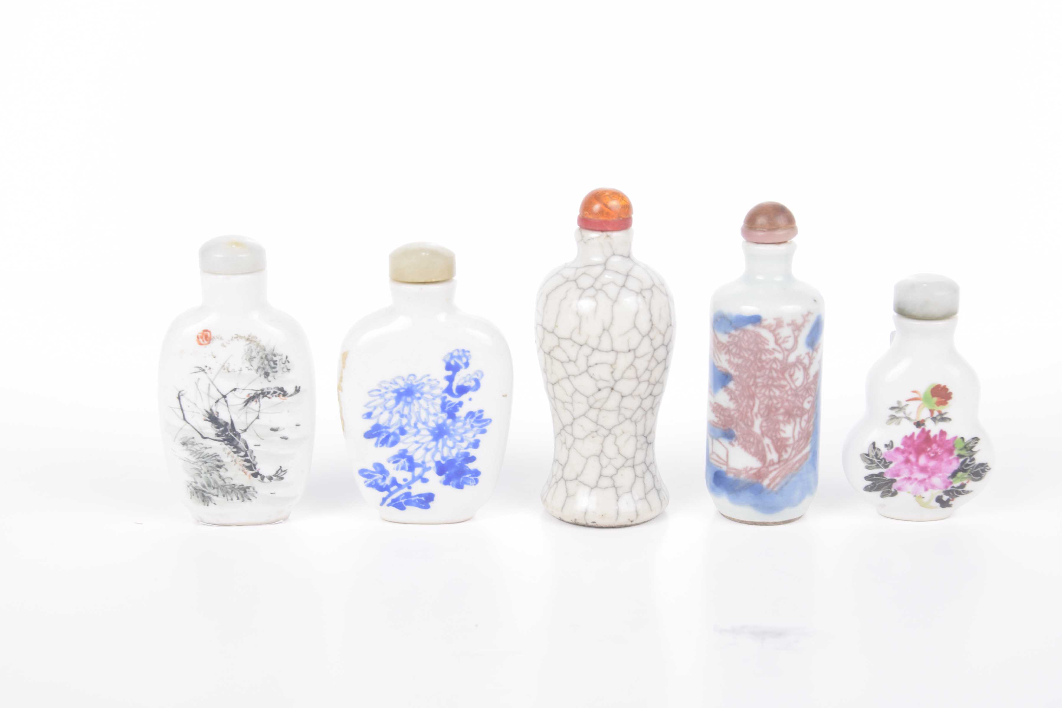 A small group of 19th Century and later Chinese porcelain snuff bottles To include a grey crackle