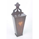 An early 19th Century mahogany candle box Of typical tapering form with a hinged cover and a heart