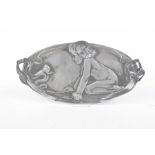 A WMF pewter tray, early 20th Century The oval tray with decoration of a naked young child,