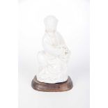 A Blanc-de-chine figure of Guanyin,