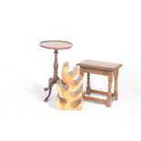 Three items of furniture To include a novelty carved hardwood wine rack,
