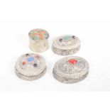 A collection of South East Asian white metal and enamel boxes Each of the various chased and