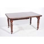A Victorian mahogany extending dining table The rectangular moulded top with rounded corners and a