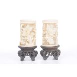 A pair of Chinese carved ivory tusk vases,