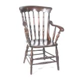 A 19th Century stained hardwood Windsor farmhouse elbow chair Having a concave top rail supported