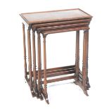An early 20th Century quartet of mahogany tea tables The largest table with a beaded edge,