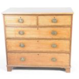 A 19th Century mahogany chest of drawers With a rectangular cross banded top above two short and