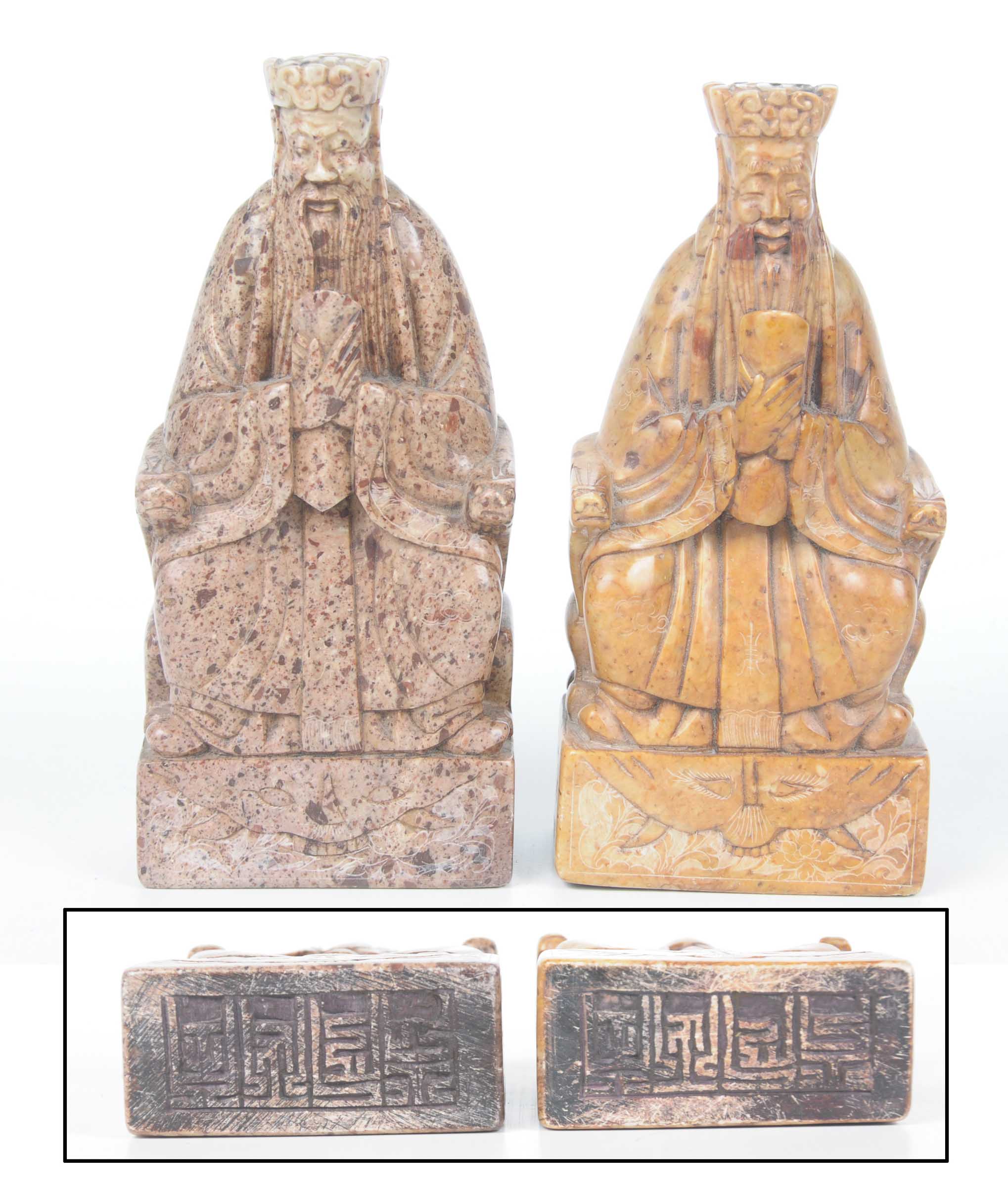 A pair of Chinese carved soapstone seal figures of officials Each raised on a square plinth with