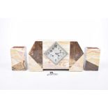 An Art Deco variegated marble mantle clock set,