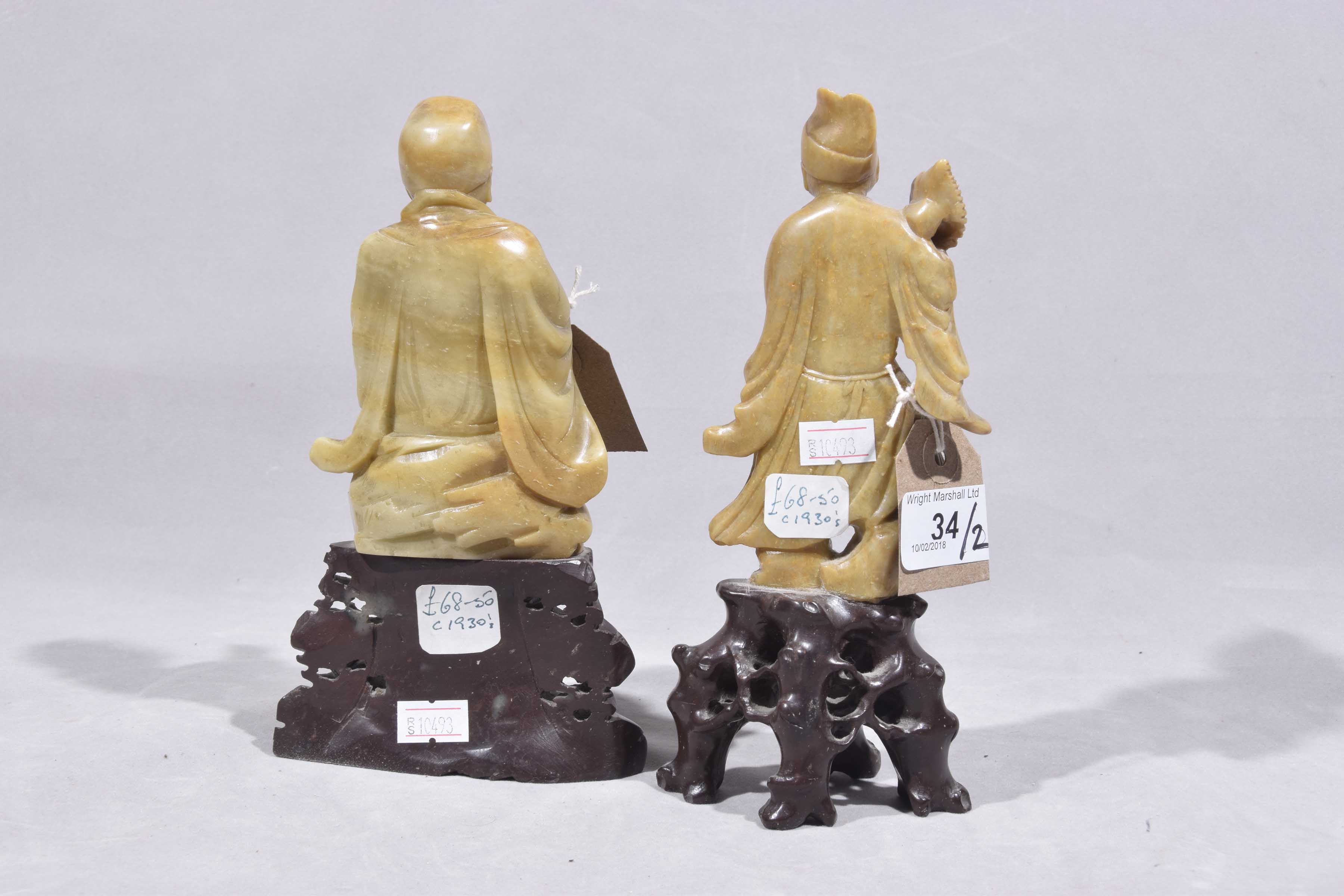 Two Chinese carved hardstone figures of immortal gods Each carved on a rocky outcrop, - Image 4 of 5