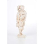 A Japanese carved ivory Okimono of a monkey trainer The male figure dressed in robes and hat,