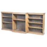 An impressive early 20th Century breakfront open bookcase The well proportioned bookcase with a