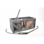 A cased bellows heating system, early 20th century Bellows operated by pulling lever,