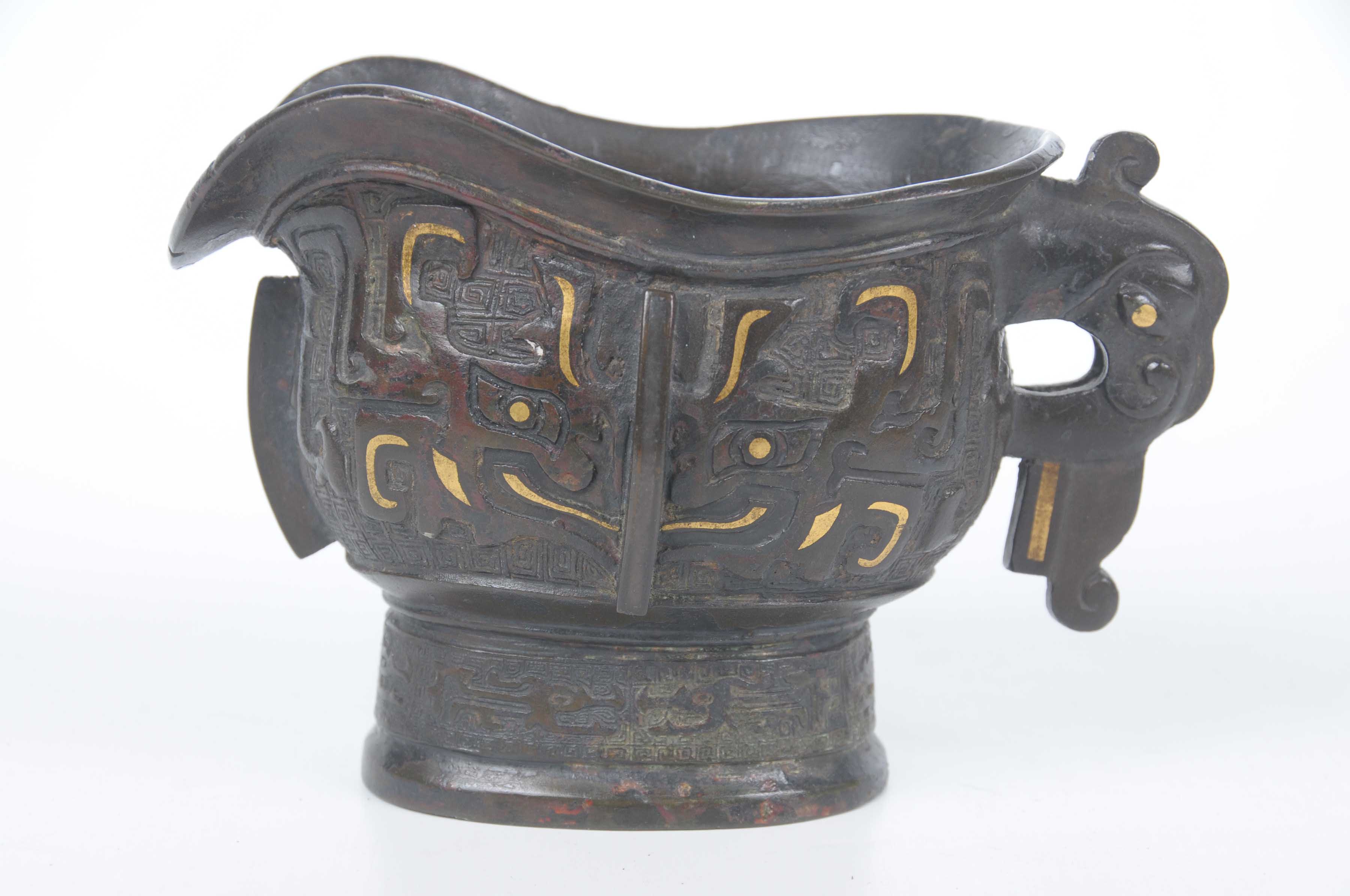 A Chinese bronze spouted wine vessel (Gong) The cast bronze vessel (used for pouring rice wine at