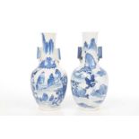 A pair of Chinese blue and white bottle vases, 19th Century Each rounded form,