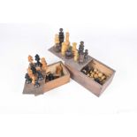 Two carved wooden chess sets/early to mid 20th century Each set housed in a wooden box.