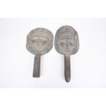 A pair of carved hardwood rice paddles, possibly Indonesian.