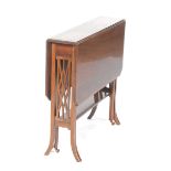 An Edwardian mahogany Sutherland table The rectangular drop leaf top with satinwood crossbanding