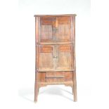 A Chinese hardwood cabinet Of splayed tapered form,