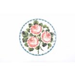 A Griselda Hill pottery 'Rose' pattern plate Of circular form,