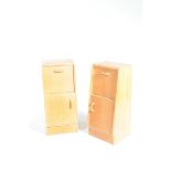 A pair of 1960's / 70's light oak bedside cabinets Each with a fall front above a cupboard door