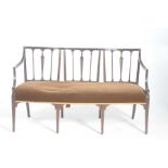 A 19th Century Sheraton style triple chair back settee The slender rail back centered with three