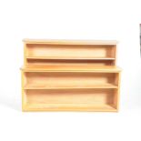 Two modern pine open bookcases The first with two adjustable shelves,