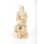 A Japanese carved ivory okimono,