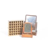 Two 19th Century toilet mirrors and a display case To include a mahogany toilet mirror with a