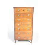 A 19th Century mahogany tall chest Having seven drawers each applied with circular beaded brass
