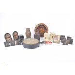 A collection of assorted carved stone and carved wood ornaments,