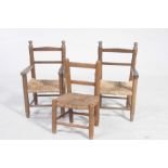 The child's stained beech chairs Including two elbow chairs, each chair with an envelope rush seat,