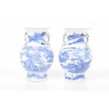 A pair of Chinese blue and white vases, Kangxi (1654-1722) Each of baluster form,