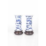 A pair of Chinese blue and white Gu vases on stands, 20th century Each of waisted form,