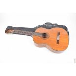 A B & M "Rolif acoustic guitar" late 20th Century The wooden bodied guitar with inlaid decoration,