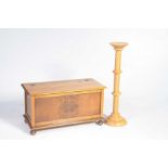 An early 20th Century oak blanket chest and a beechwood plant stand The blanket chest with a