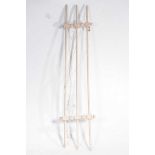 An early 20th Century painted pine hanging clothes airer Having three parallel poles joined by