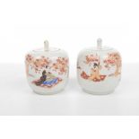 A pair of Japanese lidded pots, early 20th Century Of rounded form with integrated flat cover,