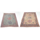 Two Persian style rugs The pink and turquoise ground detailed with three circular lozenge,