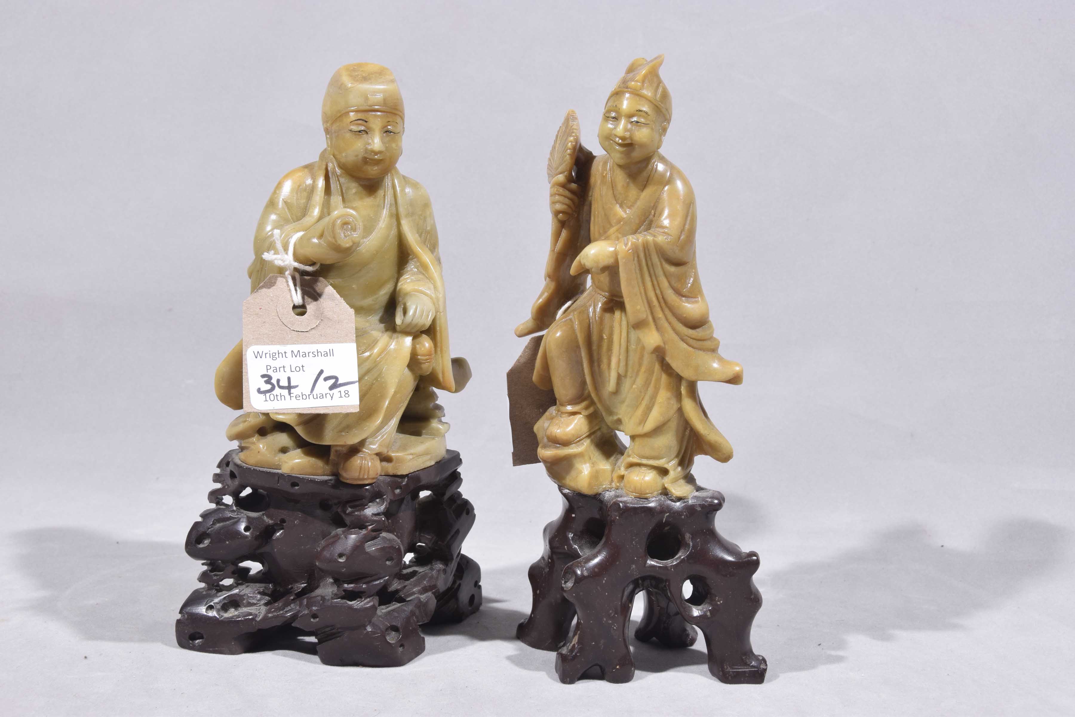 Two Chinese carved hardstone figures of immortal gods Each carved on a rocky outcrop, - Image 3 of 5