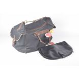 A Vintage Gucci travel holdall The printed 'G' design bag, with tan leather trim,