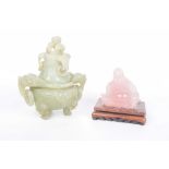 Two Chinese hard stone carvings The first a green hard stone tripod censer of bombe form with lion