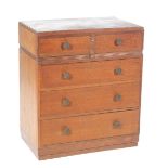 A mid 20th Century medium oak chest of drawers With an arrangement of two short and three long