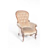 A Victorian mahogany and upholstered balloon back drawing room chair The balloon back with a