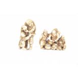 Two carved Japanese ivory netsuke, early 20th century Modelled as a father and boy,