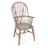 A 19th Century stained elm and beech Windsor farmhouse elbow chair The arched stick back above a